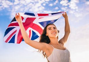 British woman holding Union Jack flag